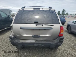 2000 Jeep Grand Cherokee Laredo with VIN 1J4GW48S9YC390448, listed as a Copart auction lot 56985265 with Not provided miles and Salvage title. Bid and sale history available at DreamBid. Image 6.