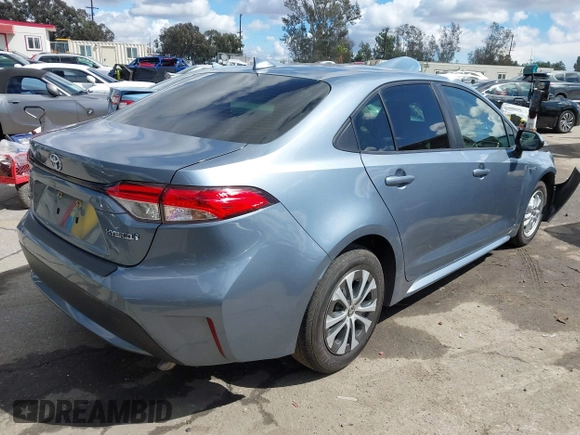 2021 Toyota Corolla Hybrid LE with VIN JTDEAMDE0MJ026601, listed as a IAAI auction lot 41797452 with 85,294 mi miles. Bid and sale history available at carsss.com. Image 4.