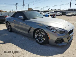 2024 BMW Z4 sDrive30i with VIN WBAHF3C06RWY36286, listed as a Copart auction lot 50296565 with 9,898 mi miles and Salvage title. Bid and sale history available at DreamBid. Image 4.
