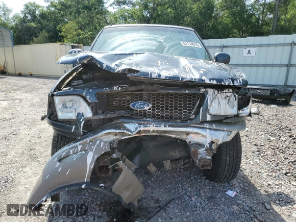2001 Ford F-150 XLT z VIN 1FTRW08L21KB37421, wystawiony jako Copart lot #57114015 z przebiegiem 288 942 mil mil oraz Szkoda całkowita • Salvage title. Historia ofert i sprzedaży dostępna na DreamBid. Obrazek 5.