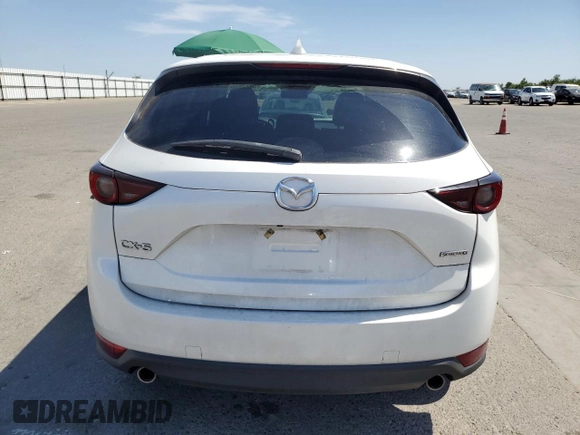2020 Mazda CX-5 Touring z VIN JM3KFACM7L0833480, wystawiony jako Copart lot #58270225 z przebiegiem 46 061 mil mil oraz Szkoda całkowita • Salvage title. Historia ofert i sprzedaży dostępna na DreamBid. Obrazek 6.