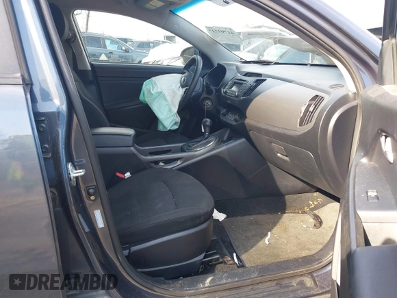2013 Kia Sportage LX z VIN KNDPBCA2XD7428262, wystawiony jako IAAI lot #41793737 z przebiegiem 82 853 mil mil oraz . Historia ofert i sprzedaży dostępna na DreamBid. Obrazek 5.
