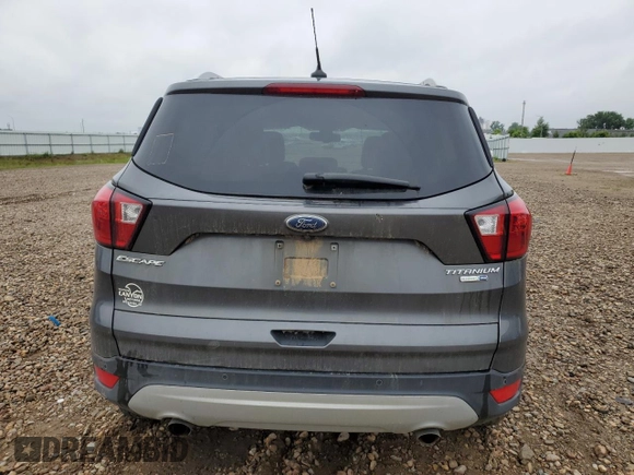 2019 Ford Escape Titanium z VIN 1FMCU9J99KUC31182, wystawiony jako Copart lot #60972815 z przebiegiem 94 464 mil mil oraz Szkoda całkowita • Salvage title. Historia ofert i sprzedaży dostępna na DreamBid. Obrazek 6.