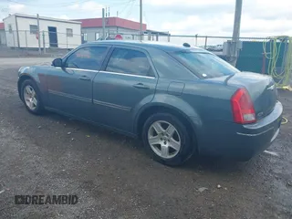 2005 Chrysler 300 with VIN 2C3AA53G55H186617, listed as a IAAI auction lot 42004943 with 230,956 mi miles. Bid and sale history available at carsss.com. Image 3.