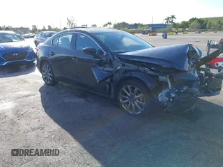 2021 Mazda 3 Premium with VIN JM1BPADL7M1303484, listed as a IAAI auction lot 41666785 with 34,476 mi miles and . Bid and sale history available at DreamBid. Image 1.