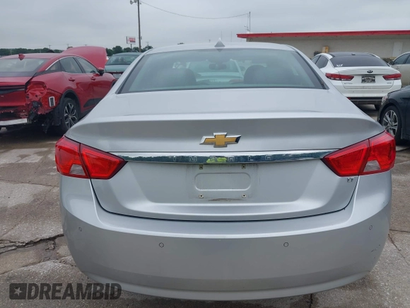 2014 Chevrolet Impala LT with VIN 2G1125S33E9103583, listed as a IAAI auction lot 42125293 with 143,951 mi miles and . Bid and sale history available at DreamBid. Image 16.