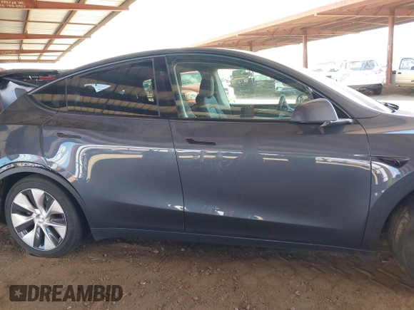 2023 Tesla Model Y Long Range with VIN 7SAYGDEE4PF875915, listed as a IAAI auction lot 42095178 with 11,928 mi miles and . Bid and sale history available at DreamBid. Image 13.