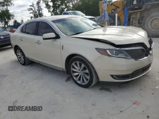 2014 Lincoln MKS with VIN 1LNHL9DKXEG612758, listed as a Copart auction lot 53230065 with 98,863 mi miles and Salvage Title. Bid and sale history available at carsss.com. Image 4.