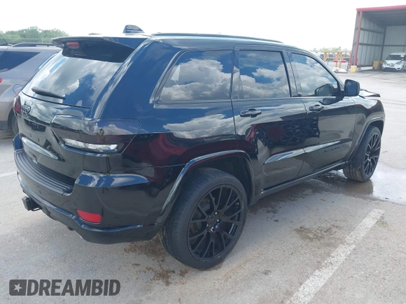 2021 Jeep Grand Cherokee Laredo X with VIN 1C4RJFAG2MC516111, listed as a IAAI auction lot 42222439 with 60,888 mi miles and . Bid and sale history available at DreamBid. Image 4.