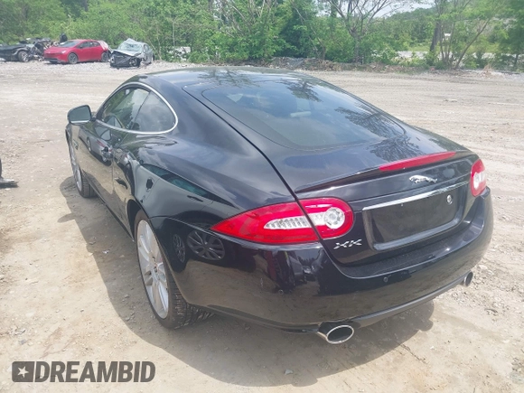 2012 Jaguar XK with VIN SAJWA4FB8CLB47049, listed as a IAAI auction lot 42118136 with 60,953 mi miles. Bid and sale history available at carsss.com. Image 3.