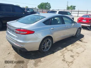 2020 Ford Fusion SEL with VIN 3FA6P0CDXLR196124, listed as a IAAI auction lot 42244231 with 99,306 mi miles and . Bid and sale history available at DreamBid. Image 4.