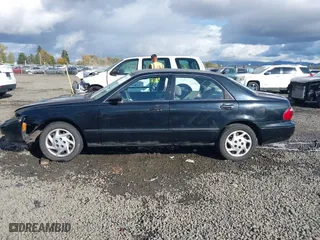 2000 Mazda 626 LX with VIN 1YVGF22CXY5123930, listed as a IAAI auction lot 40712369 with 210,234 mi miles. Bid and sale history available at carsss.com. Image 14.