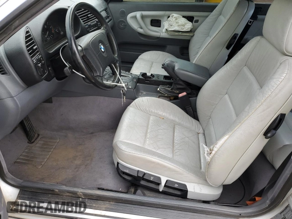 1998 BMW 3 Series 323i with VIN WBABJ8332WEM22760, listed as a Copart auction lot 59631805 with 77,300 mi miles and Salvage title. Bid and sale history available at DreamBid. Image 7.