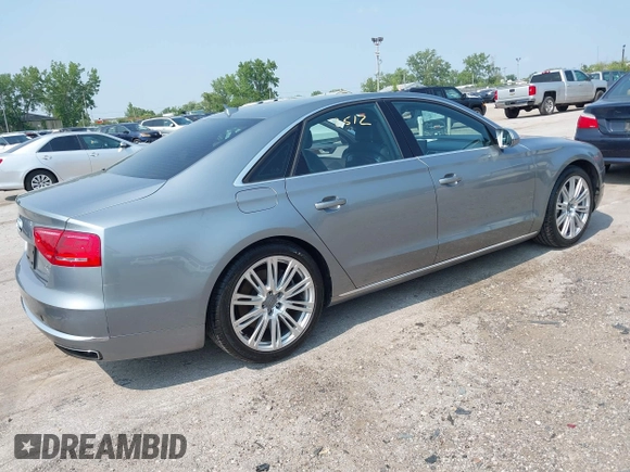2013 Audi A8 4.0L with VIN WAUA2AFD5DN021950, listed as a IAAI auction lot 42472512 with 126,964 mi miles and . Bid and sale history available at DreamBid. Image 4.