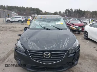 2016 Mazda CX-5 Grand Touring with VIN JM3KE4DY1G0685449, listed as a IAAI auction lot 41162840 with 134,525 mi miles. Bid and sale history available at carsss.com. Image 13.