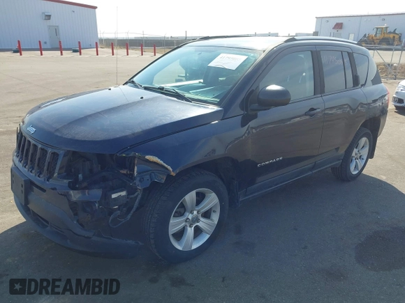 2011 Jeep Compass with VIN 1J4NT1FA7BD208658, listed as a IAAI auction lot 41795085 with 198,880 mi miles. Bid and sale history available at carsss.com. Image 2.