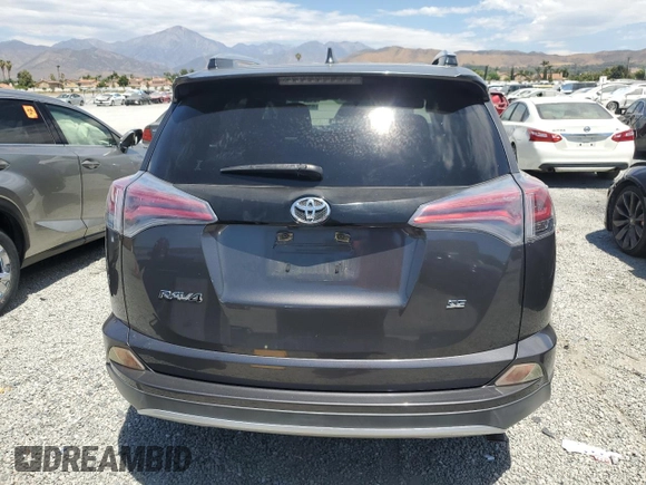 2016 Toyota RAV4 SE with VIN JTMNFREV2GJ072643, listed as a Copart auction lot 63879695 with 104,118 mi miles and Salvage title. Bid and sale history available at DreamBid. Image 6.