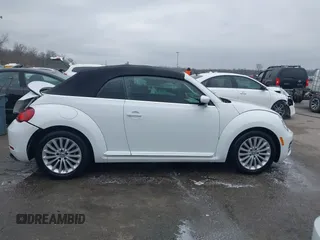 2019 Volkswagen Beetle S with VIN 3VW5DAAT4KM504847, listed as a IAAI auction lot 41582981 with 54,546 mi miles and . Bid and sale history available at DreamBid. Image 14.