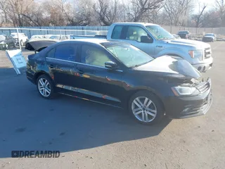 2015 Volkswagen Jetta SEL z VIN 3VWL17AJ9FM281860, wystawiony jako IAAI lot #41200741 z przebiegiem 87 062 mil mil oraz . Historia ofert i sprzedaży dostępna na DreamBid. Obrazek 1.