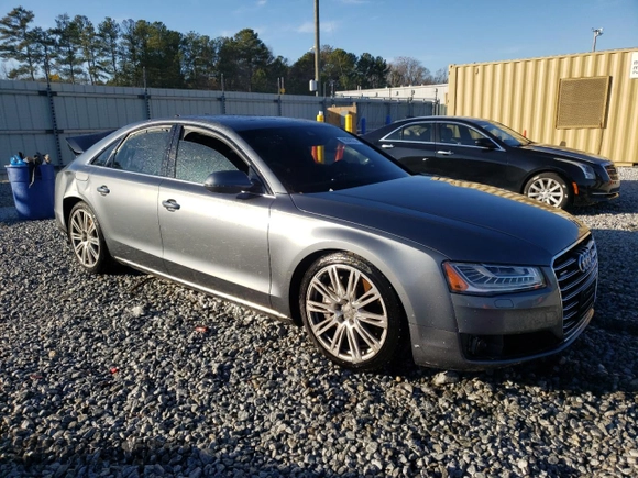 2015 Audi A8 z VIN WAUJGAFD9FN022023, wystawiony jako Copart lot #86048354 z przebiegiem Nie podano mil oraz Szkoda całkowita • Salvage title. Historia ofert i sprzedaży dostępna na DreamBid. Obrazek 4.