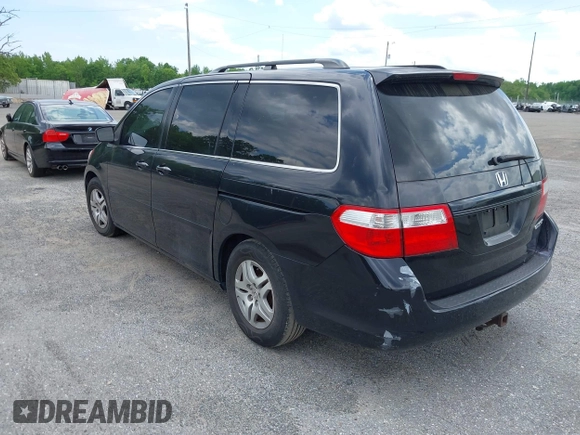 2005 Honda Odyssey EX-L with VIN 5FNRL38775B085512, listed as a IAAI auction lot 42128261 with Not Provided miles and . Bid and sale history available at DreamBid. Image 3.