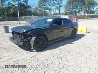 2019 Dodge Charger SXT with VIN 2C3CDXBG6KH702928, listed as a IAAI auction lot 41691312 with 108,832 mi miles and . Bid and sale history available at DreamBid. Image 2.