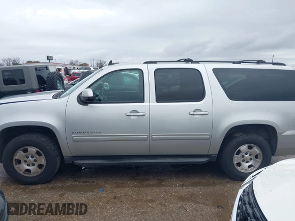 2011 Chevrolet Suburban LS with VIN 1GNSCHE06BR188407, listed as a IAAI auction lot 41453215 with 232,667 mi miles. Bid and sale history available at carsss.com. Image 14.