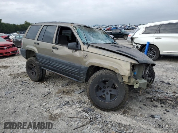 1996 Jeep Grand Cherokee Laredo with VIN 1J4GZ58S3TC297818, listed as a Copart auction lot 67712584 with 284,653 mi miles and Salvage Title. Bid and sale history available at carsss.com. Image 4.