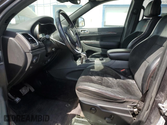 2017 Jeep Grand Cherokee Trailhawk with VIN 1C4RJFLGXHC654112, listed as a Copart auction lot 56397195 with 168,136 mi miles and Salvage title. Bid and sale history available at DreamBid. Image 7.