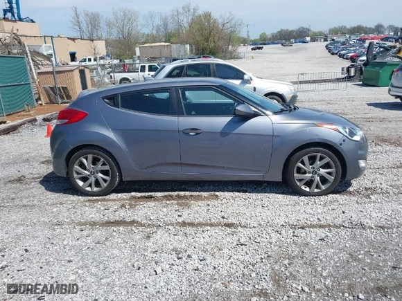 2017 Hyundai Veloster with VIN KMHTC6AD8HU305853, listed as a IAAI auction lot 41915404 with 115,663 mi miles. Bid and sale history available at carsss.com. Image 13.