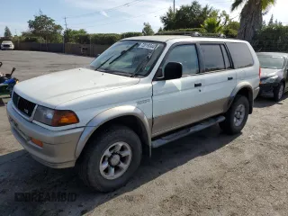 1998 Mitsubishi Montero z VIN JA4LS31P1WP029117, wystawiony jako Copart lot #72069334 z przebiegiem 172 069 mil mil oraz Szkody całkowita. Historia ofert i sprzedaży dostępna na DreamBid. Obrazek 1.