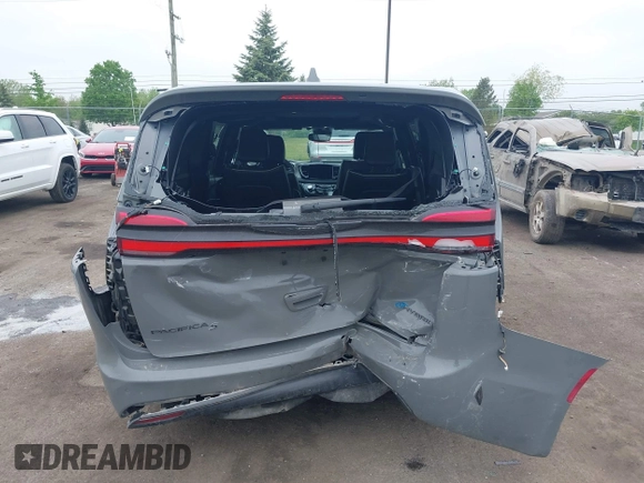 2022 Chrysler Pacifica Hybrid Limited with VIN 2C4RC1S74NR212475, listed as a IAAI auction lot 42264228 with 48,839 mi miles and . Bid and sale history available at DreamBid. Image 16.