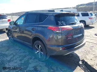 2016 Toyota RAV4 XLE with VIN 2T3RFREV4GW437875, listed as a IAAI auction lot 41694951 with 136,098 mi miles. Bid and sale history available at carsss.com. Image 3.