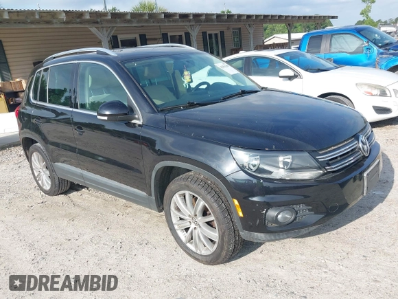 2012 Volkswagen Tiguan SE z VIN WVGAV7AX7CW535575, wystawiony jako IAAI lot #42351369 z przebiegiem 93 501 mil mil oraz . Historia ofert i sprzedaży dostępna na DreamBid. Obrazek 1.