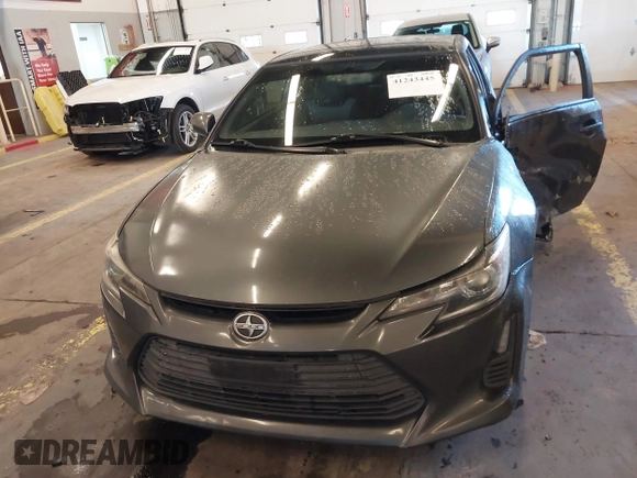 2014 Scion tC with VIN JTKJF5C77E3069906, listed as a IAAI auction lot 41243445 with 128,791 mi miles. Bid and sale history available at carsss.com. Image 12.