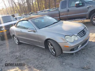 2005 Mercedes-Benz CLK 5.0L with VIN WDBTK75J85F126398, listed as a IAAI auction lot 41890954 with 124,554 mi miles. Bid and sale history available at carsss.com. Image 1.