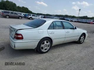 1999 Infiniti Q45 z VIN JNKBY31A2XM603477, wystawiony jako Copart lot #64216924 z przebiegiem 278 602 mil mil oraz Szkody całkowita. Historia ofert i sprzedaży dostępna na DreamBid. Obrazek 3.