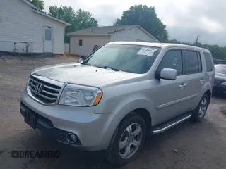 2015 Honda Pilot EX-L with VIN 5FNYF4H5XFB014653, listed as a IAAI auction lot 42121003 with 152,912 mi miles and . Bid and sale history available at carsss.com. Image 2.