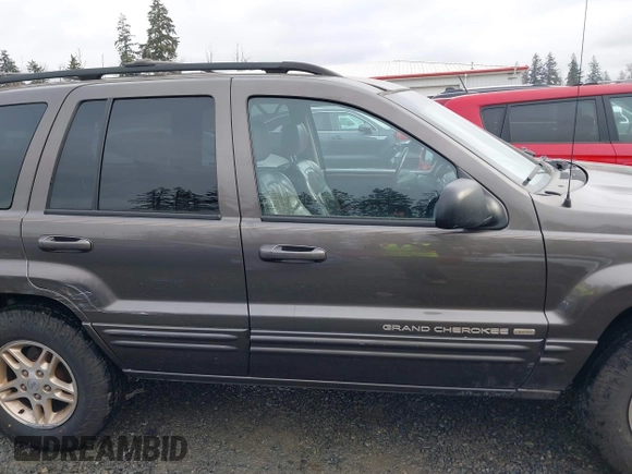 1999 Jeep Grand Cherokee Limited with VIN 1J4GW68N7XC739479, listed as a IAAI auction lot 41448323 with 129,840 mi miles. Bid and sale history available at carsss.com. Image 13.
