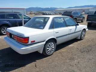 1990 Toyota Camry LE ECT z VIN JT2SV22E1L3427911, wystawiony jako IAAI lot #42040646 z przebiegiem 133 129 mil mil oraz . Historia ofert i sprzedaży dostępna na DreamBid. Obrazek 4.