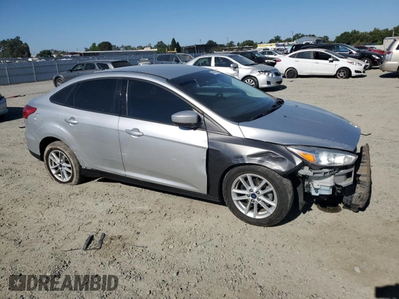 2018 Ford Focus SE with VIN 1FADP3FE4JL308909, listed as a Copart auction lot 61489005 with 58,613 mi miles and Salvage title. Bid and sale history available at DreamBid. Image 4.