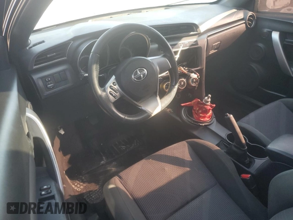 2012 Scion tC z VIN JTKJF5C73C3034583, wystawiony jako Copart lot #74317714 z przebiegiem 163 158 mil mil oraz Czysty tytuł • Clean title. Historia ofert i sprzedaży dostępna na DreamBid. Obrazek 8.