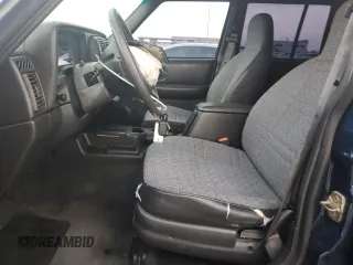 2000 Jeep Cherokee SE with VIN 1J4FT28S8YL197197, listed as a Copart auction lot 79254774 with 161,772 mi miles and Salvage Title. Bid and sale history available at carsss.com. Image 7.
