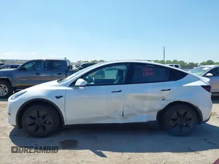 2024 Tesla Model Y with VIN 7SAYGDED0RA327806, listed as a IAAI auction lot 42096752 with 13,244 mi miles and . Bid and sale history available at DreamBid. Image 14.