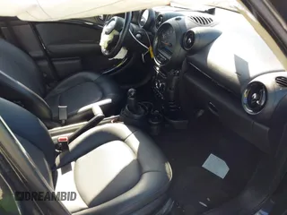 2015 MINI Countryman with VIN WMWZB3C54FWM33074, listed as a IAAI auction lot 42094992 with 86,704 mi miles and . Bid and sale history available at DreamBid. Image 5.