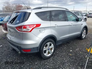 2014 Ford Escape SE with VIN 1FMCU9GX3EUD05447, listed as a IAAI auction lot 41817513 with 155,101 mi miles. Bid and sale history available at carsss.com. Image 4.