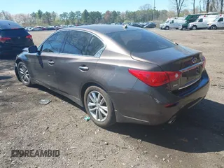 2014 Infiniti Q50 Premium with VIN JN1BV7ARXEM684719, listed as a IAAI auction lot 42122949 with 126,656 mi miles and . Bid and sale history available at DreamBid. Image 3.