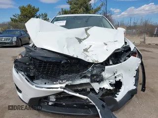 2014 Mazda CX-5 Grand Touring with VIN JM3KE4DY8E0397330, listed as a IAAI auction lot 41868116 with 180,891 mi miles. Bid and sale history available at carsss.com. Image 12.