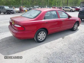 2000 Mazda 626 LX with VIN 1YVGF22C8Y5115891, listed as a IAAI auction lot 42121137 with 186,165 mi miles. Bid and sale history available at carsss.com. Image 4.