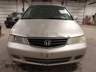 2004 Honda Odyssey EX-L with VIN 5FNRL18974B127696, listed as a IAAI auction lot 41643243 with 200,286 mi miles and . Bid and sale history available at DreamBid. Image 13.